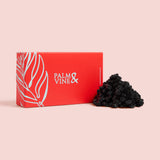 Dried blueberries against red box on pink background healthy snacking UK