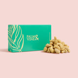 Green box with 'Palm & Vine' branding next to cashews on a pink background healthy snacking UK