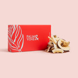 Red box with 'Palm & Vine' branding and dried coconut on a pink background healthy snacking UK