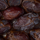 Close-up of dried medjool dates with a dark brown color, healthy snacking UK