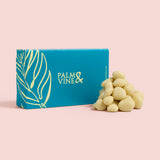 Blue box with 'Palm & Vine' branding next to a pile of yoghurt coated cranberries on a pink background healthy snacking UK