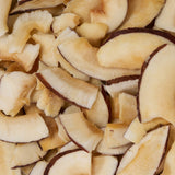 Close-up of sliced coconut pieces with brown edges healthy snacking UK