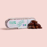 Packaged deglet nour dates with 'Palm & Vine' branding on a pink background healthy snacking UK