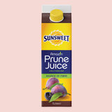 Californian prune juice in a carton on a pink background
